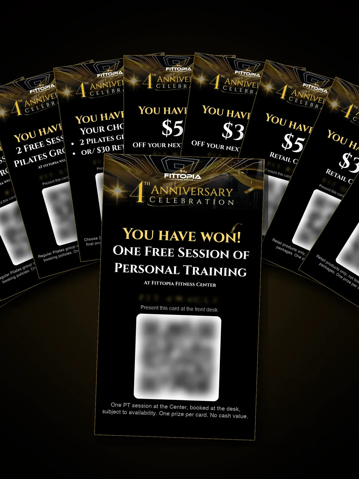 The ten 4th Anniversary prize cards fanned out, the Free PT Session card in front, each card's code and QR blurred. Ten prizes: a free PT session, a complimentary Private Pilates session, $50, $30 and $20 retail credits, 3 or 2 Pilates group classes, $50 or $30 off your next PT package, and your choice of 2 group classes or a $30 retail credit.